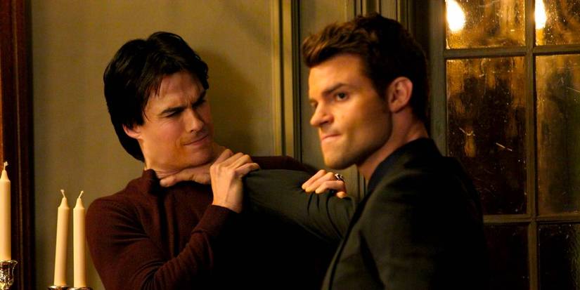 Daniel Gillies as Elijah Choking Ian Somerhalder as Damon in The Vampire Diaries