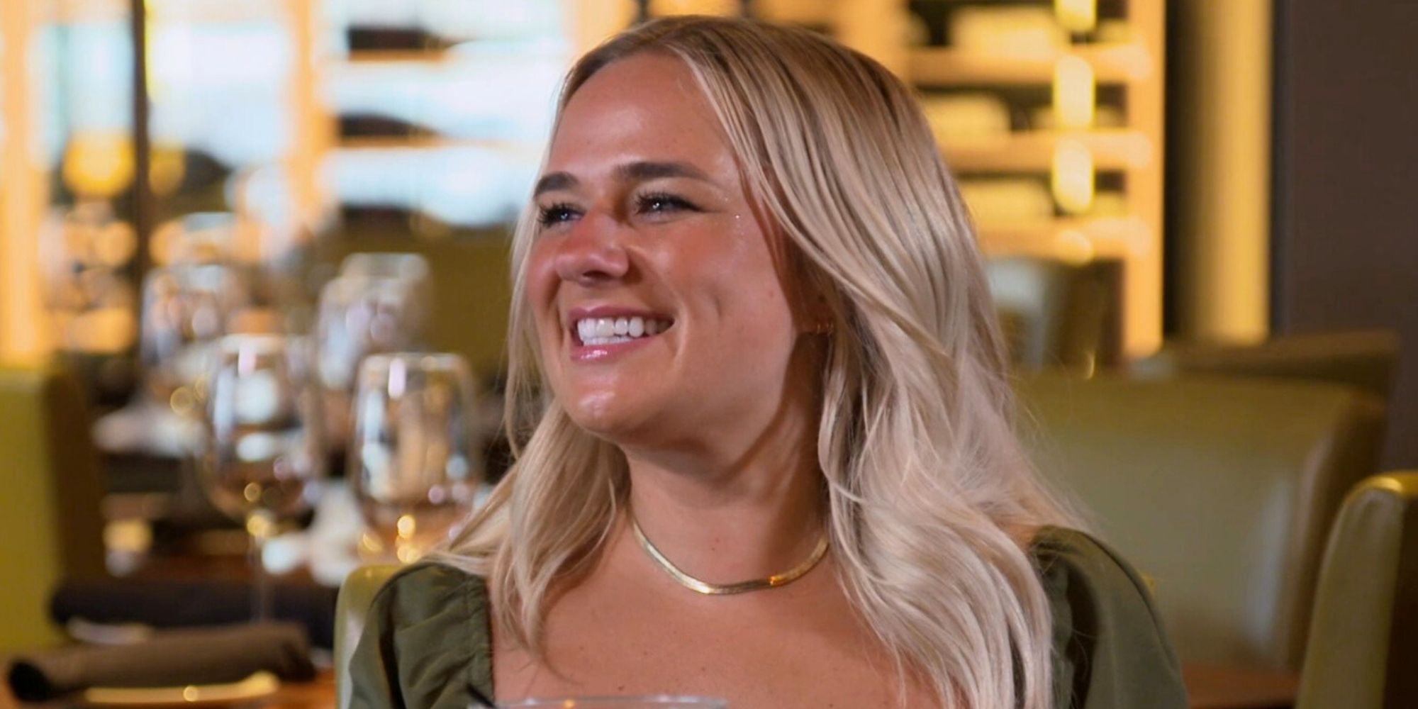 Emily Married at First Sight season 17 in green dress smiling