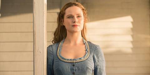 Evan Rachel Wood as Dolores Abernathy, looking into the distance in her iconic blue outfit in Westworld season 1