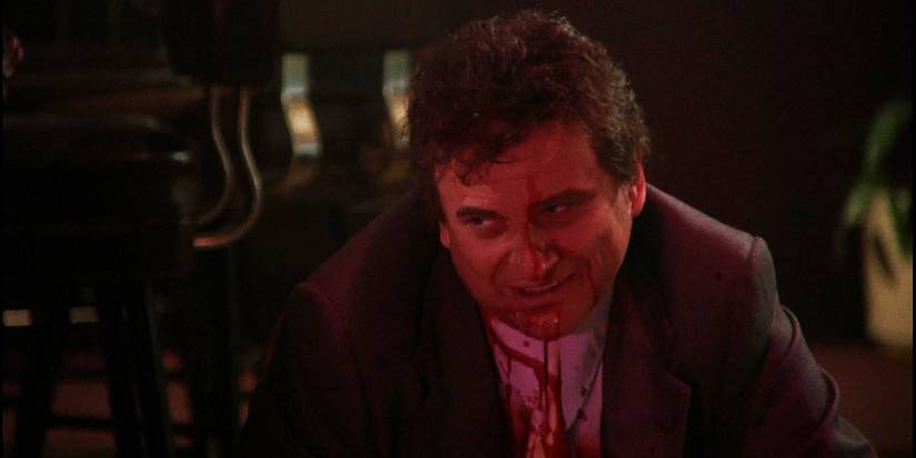 Goodfellas Tommy DeVito with blood on his shirt looking remorseful