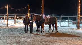 Amy and Lyndy lead horses into an arena in Heartland