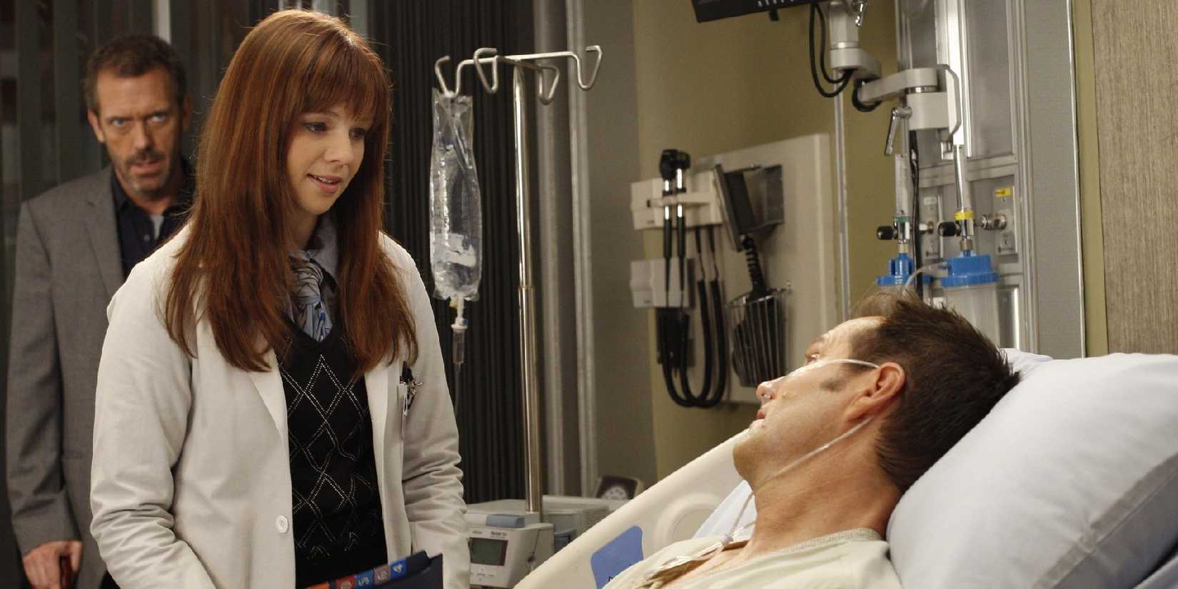 Amber Tamblyn and Hugh Laurie as Greg House and Martha Masters, standing over a patient in House, M.D.