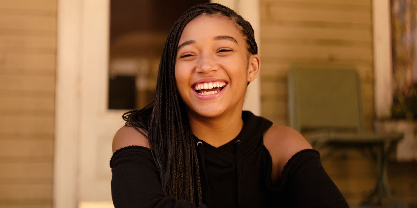 Amandla Stenberg as Starr Carter laughing in The Hate U Give.