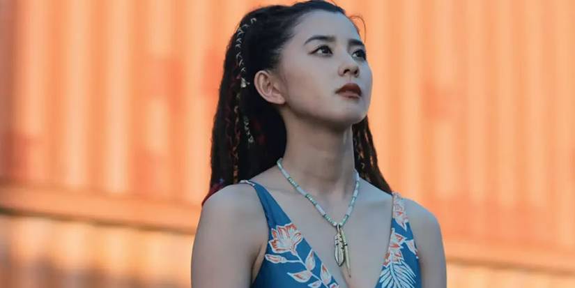 All 10 Alice In Borderland Characters & Their Alice In Wonderland Counterparts Explained Kuina in Alice in Borderland season 2 looking up