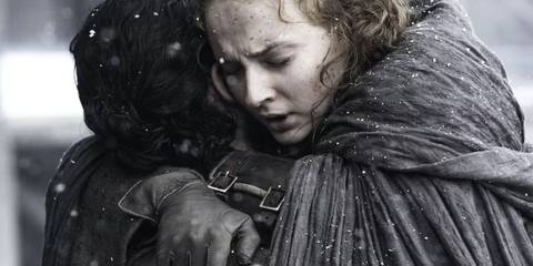 Sophie Turner as Sansa Stark hugs Kit Harington as Jon Snow in Game of Thrones