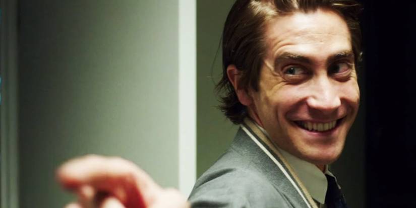 Lou Bloom, played by Jake Gyllenhaal, grinning and pointing in Nightcrawler