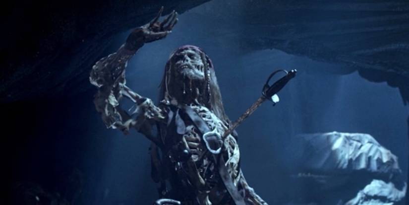 Jack Sparrow as a skeleton with a sword in his chest in Pirates of the Caribbean: The Curse of the Black Pearl