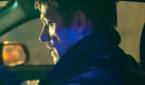 Joel Kinnaman in a car with a gun in Silent Night