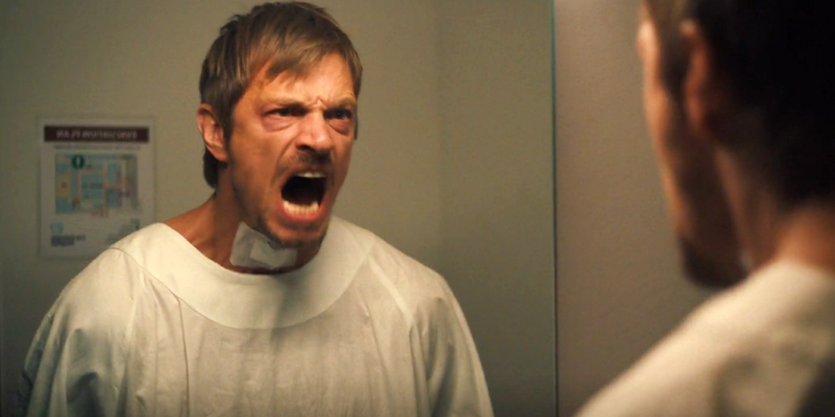 Joel Kinnaman screams in the mirror in Silent Night
