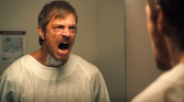Joel Kinnaman screams in the mirror in Silent Night