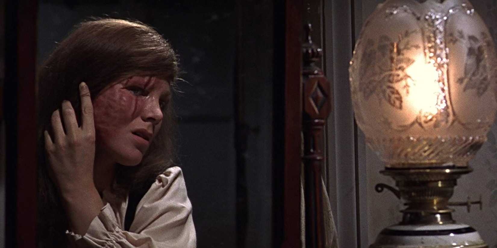 Susan Denberg as Christine looking at her scarred face in Frankenstein Created Woman