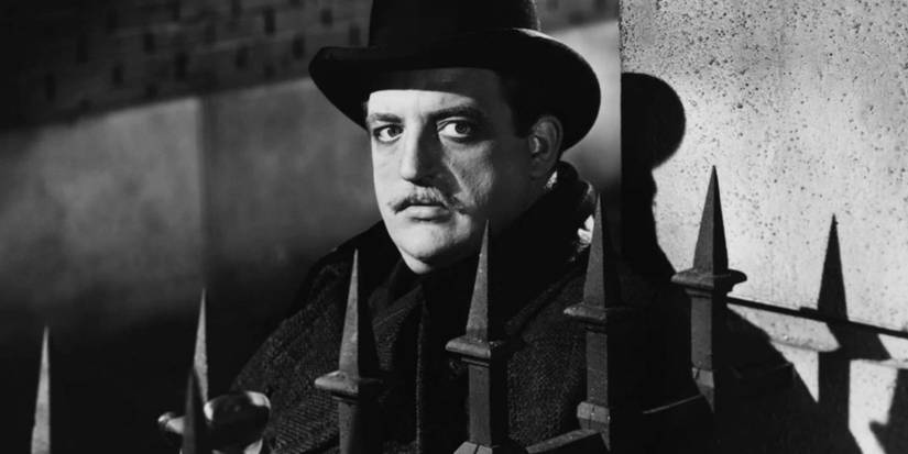 A man behind a gate in the 1944 Jack the Ripper movie The Lodger.