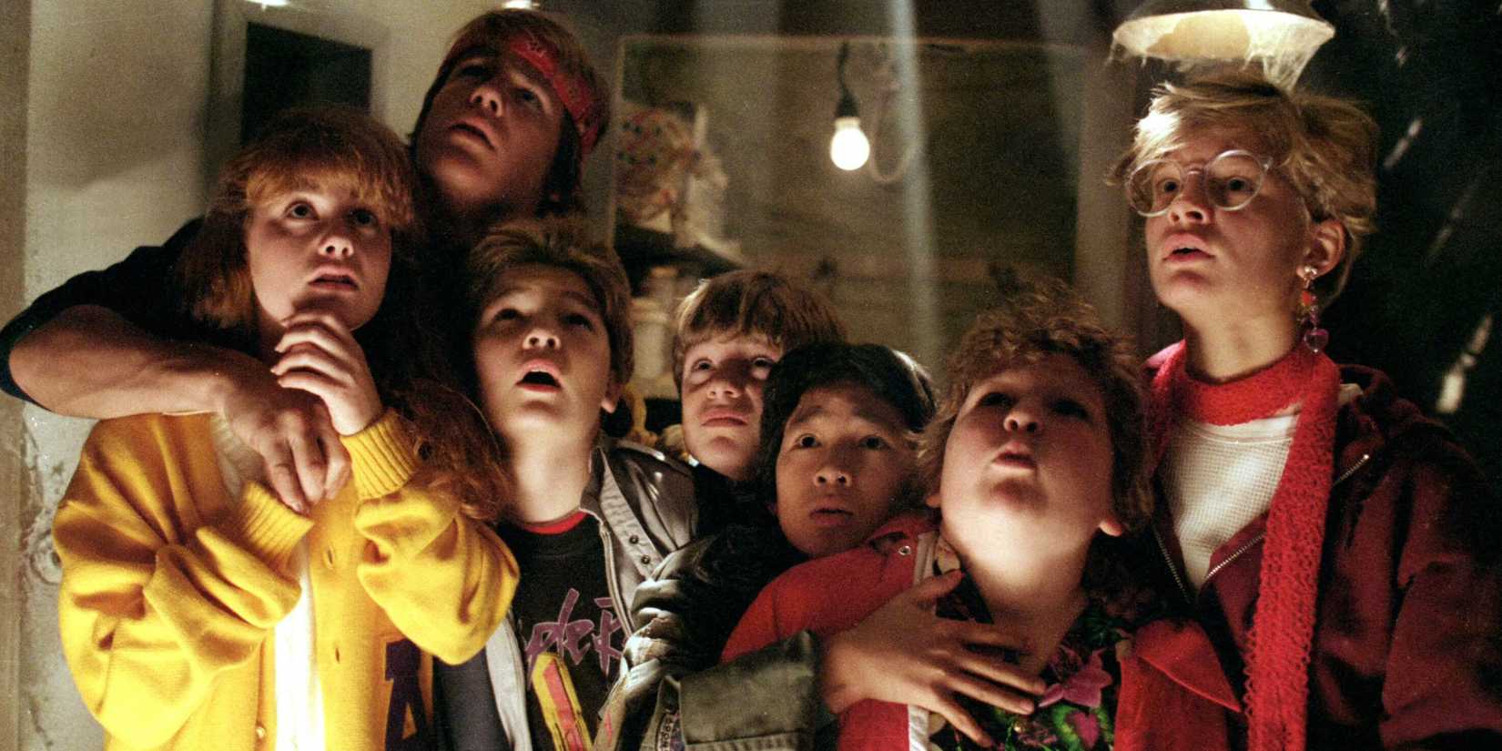 The Goonies hiding in the restaurant basement looking up