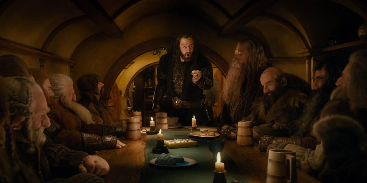 Thorin's Company sitting around the table in Bag End in The Hobbit: An Unexpected Journey