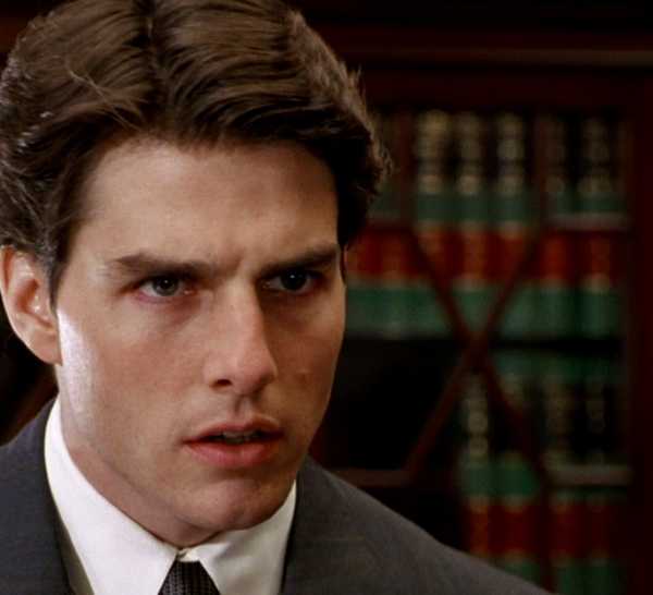 Tom Cruise as Mitch McDeere looking shocked in The Firm
