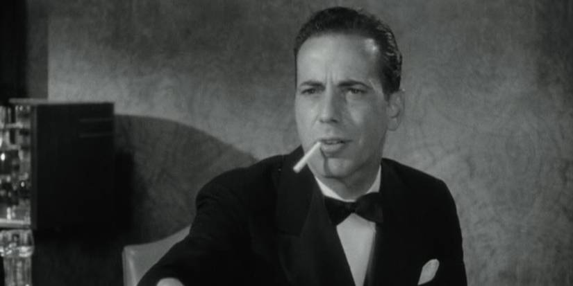 Humphrey Bogart as Jim with a cigarette in his mouth in Angels With Dirty Faces.