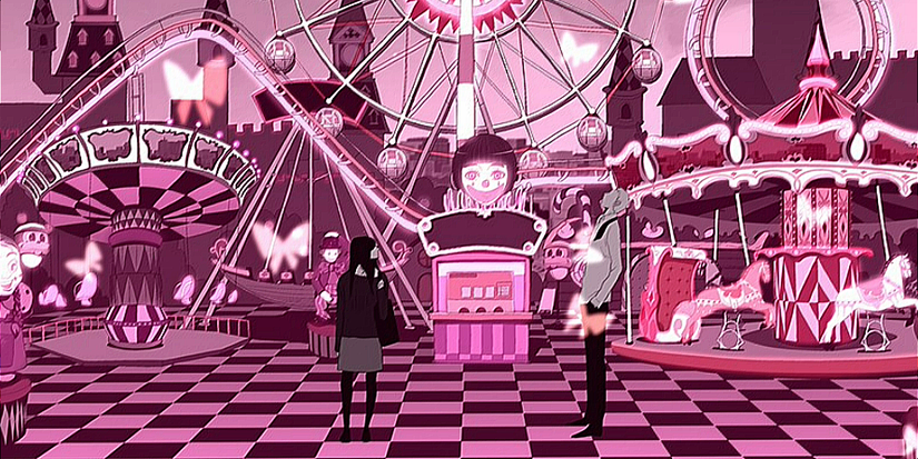 Two people stand in front of an amusement park with pink shades.