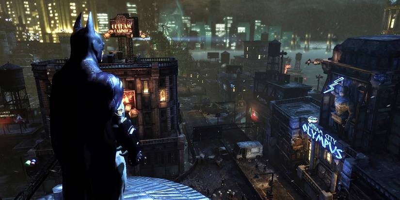Batman overlooking the city at night in the game Batman Arkham Trilogy 