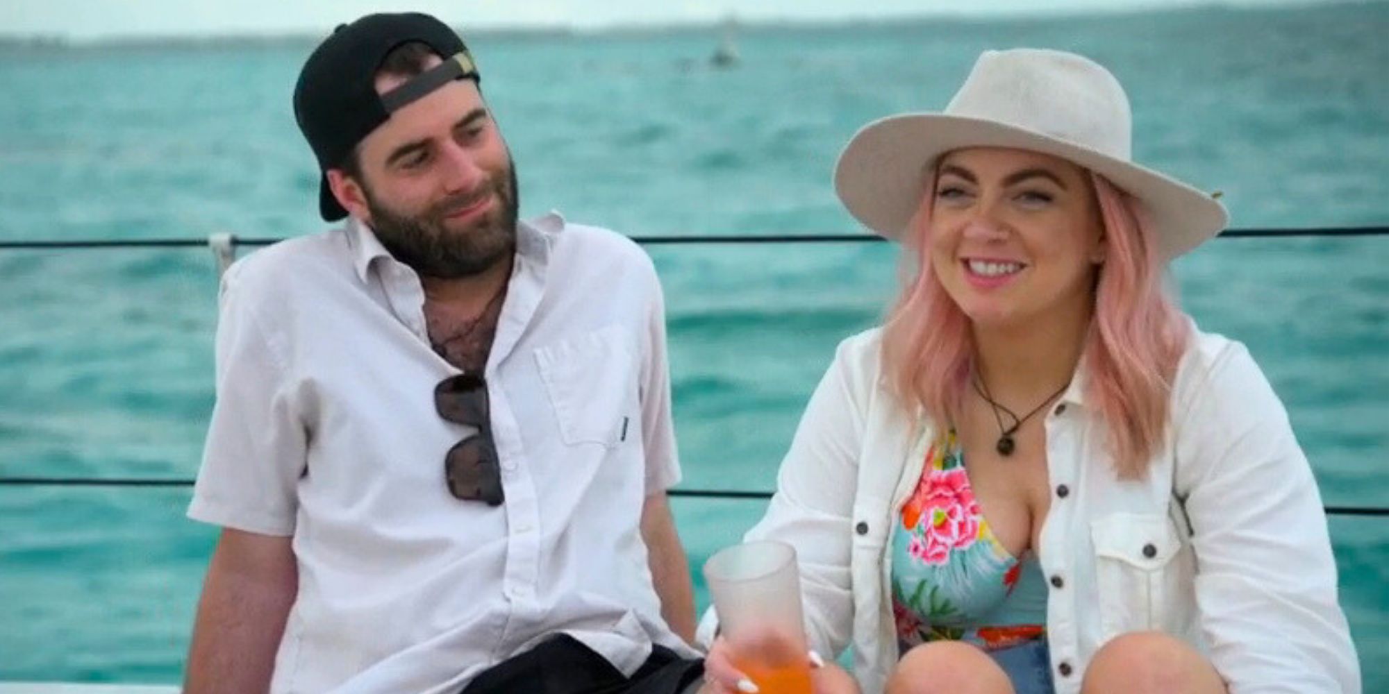 Becca and Austin from MArried at First Sight season 17 sitting on a boat taling