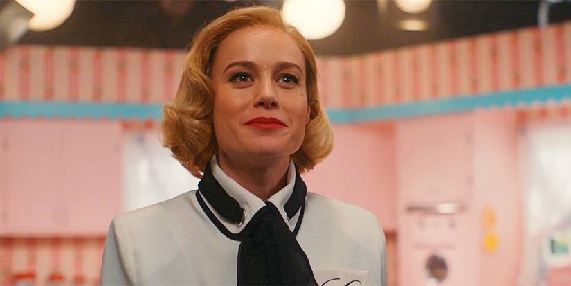 Brie Larson smiling as Elizabeth Zott in Lessons in Chemistry