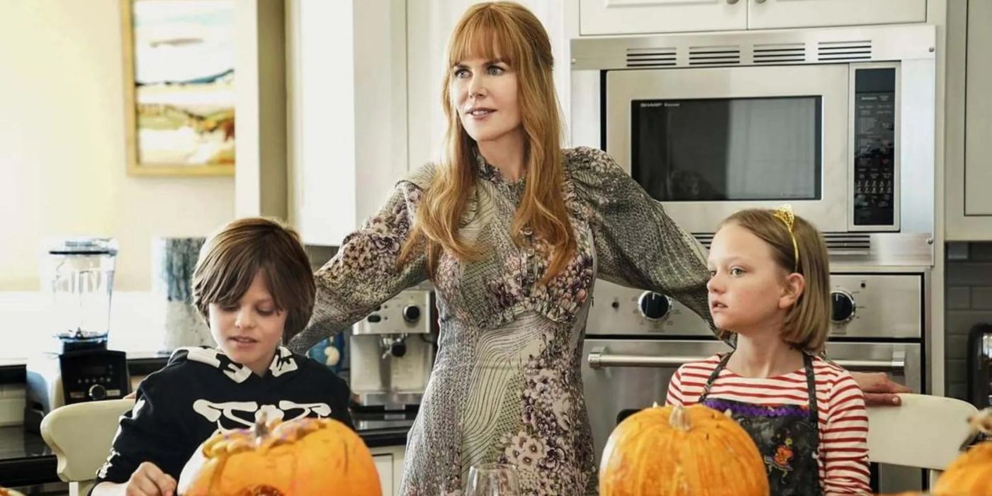 Celeste (Nicole Kidman) with her arms around kids carving pumpkins in Big Little Lies