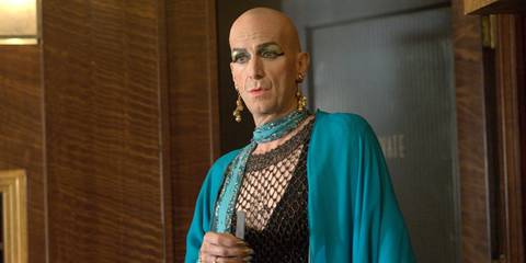 Denis O'Hare as Liz Taylor looking at someone offscreen in American Horror Story Hotel