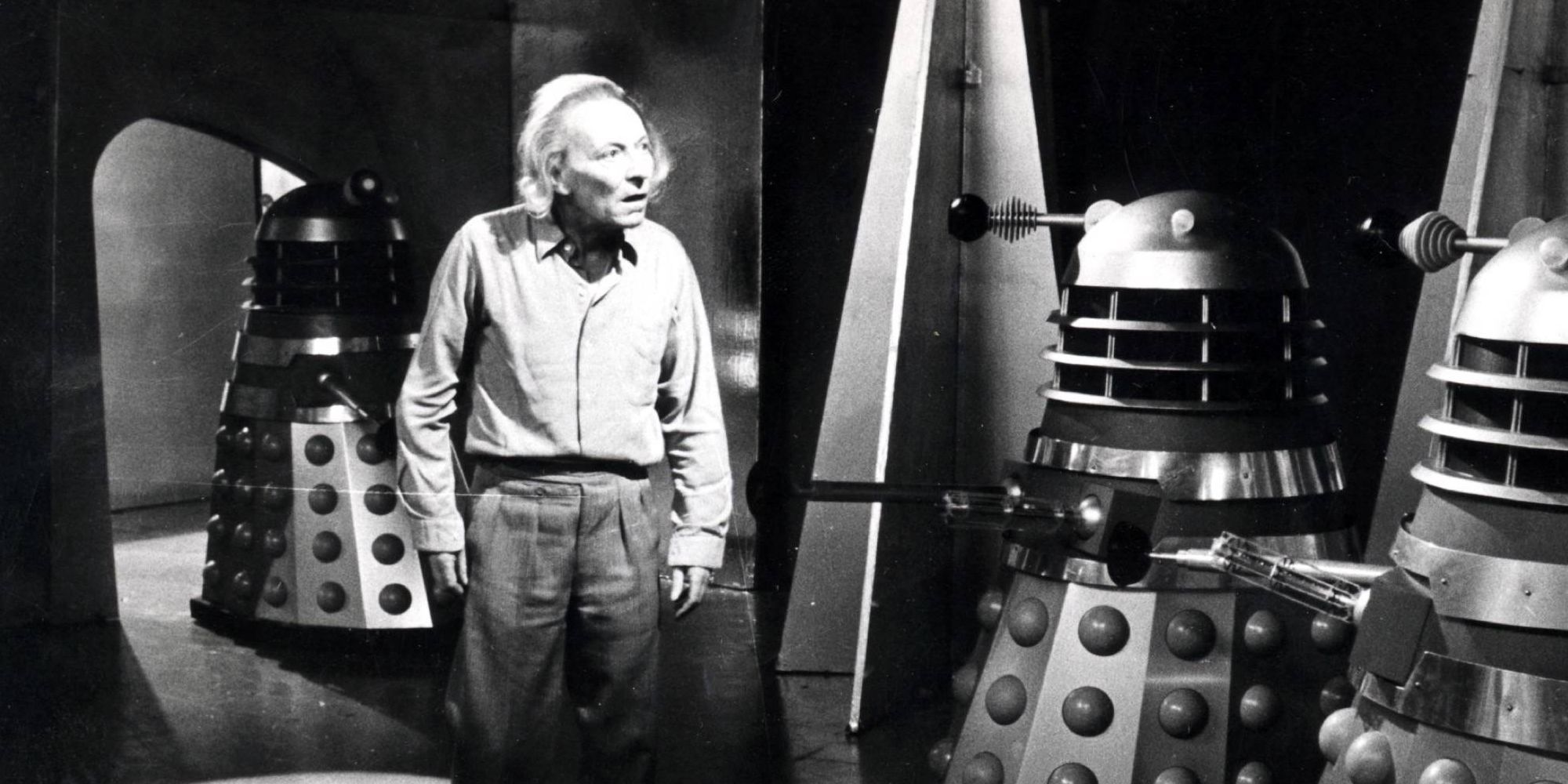 William Hartnell as the First Doctor surrounded by Daleks in Doctor Who