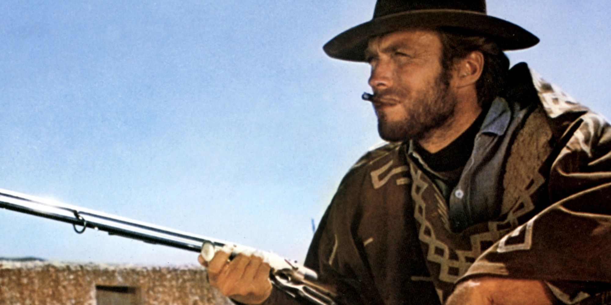 Clint Eastwood with a gun in Few A Few Dollars More