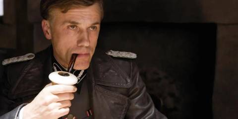 Hans Landa smokes his large pipe in Inglourious Basterds.