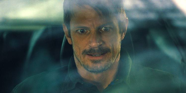Joel Kinnaman with a manic expression in Silent Night