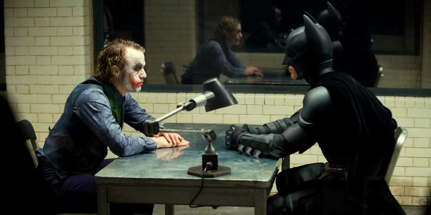 Joker and Batman in The Dark Knight looking at one another