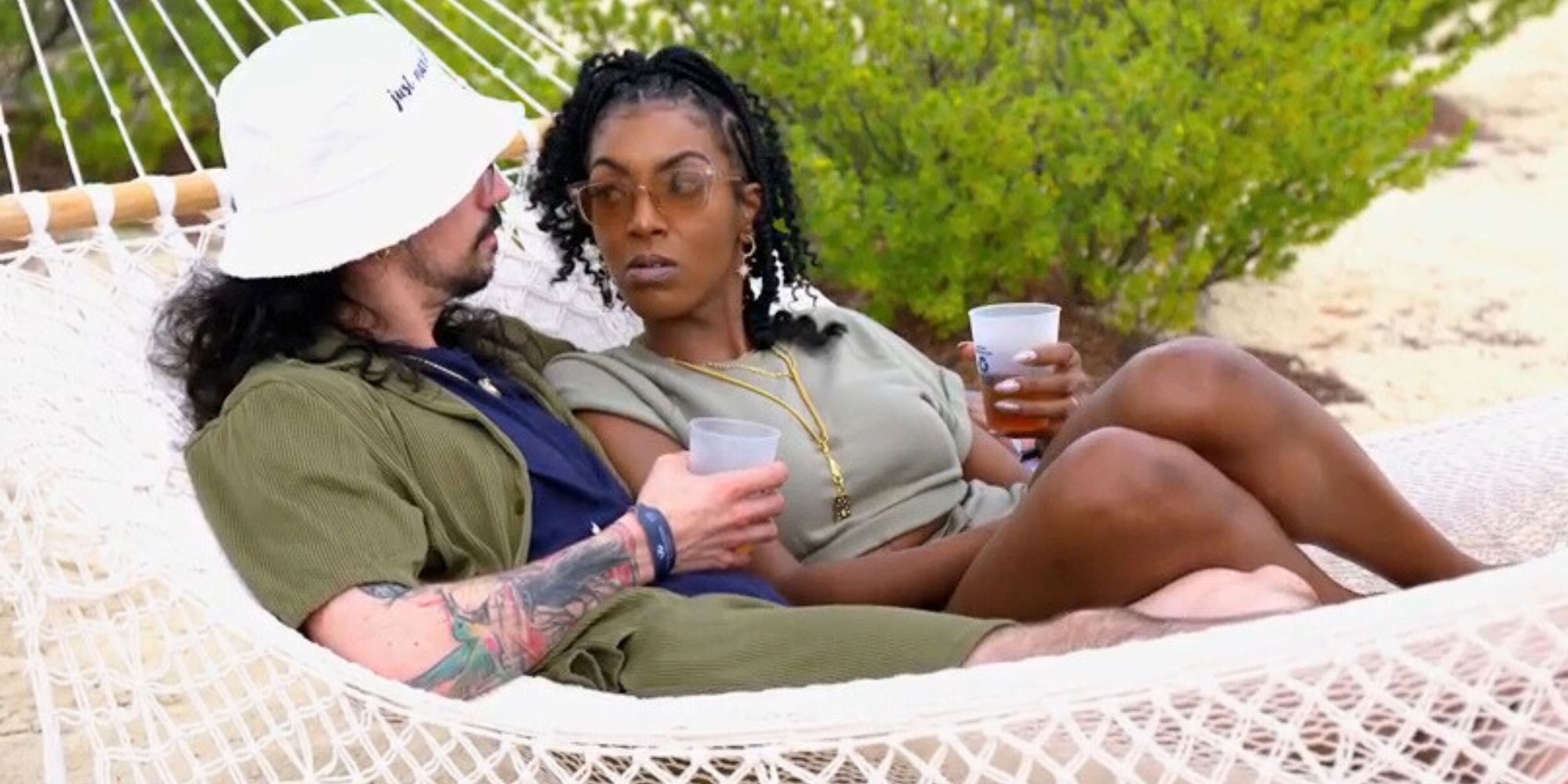 Lauren and Orion from Married at First Sight season 17 laying in hammock together