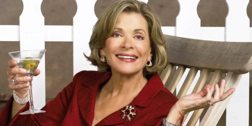 Lucille Bluth holds up a martini in one hand while she throws the other one back and to the side in Arrested Development.
