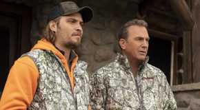 Kayce and John Dutton wearing camouflage outfits while at a lodge in Yellowstone.
