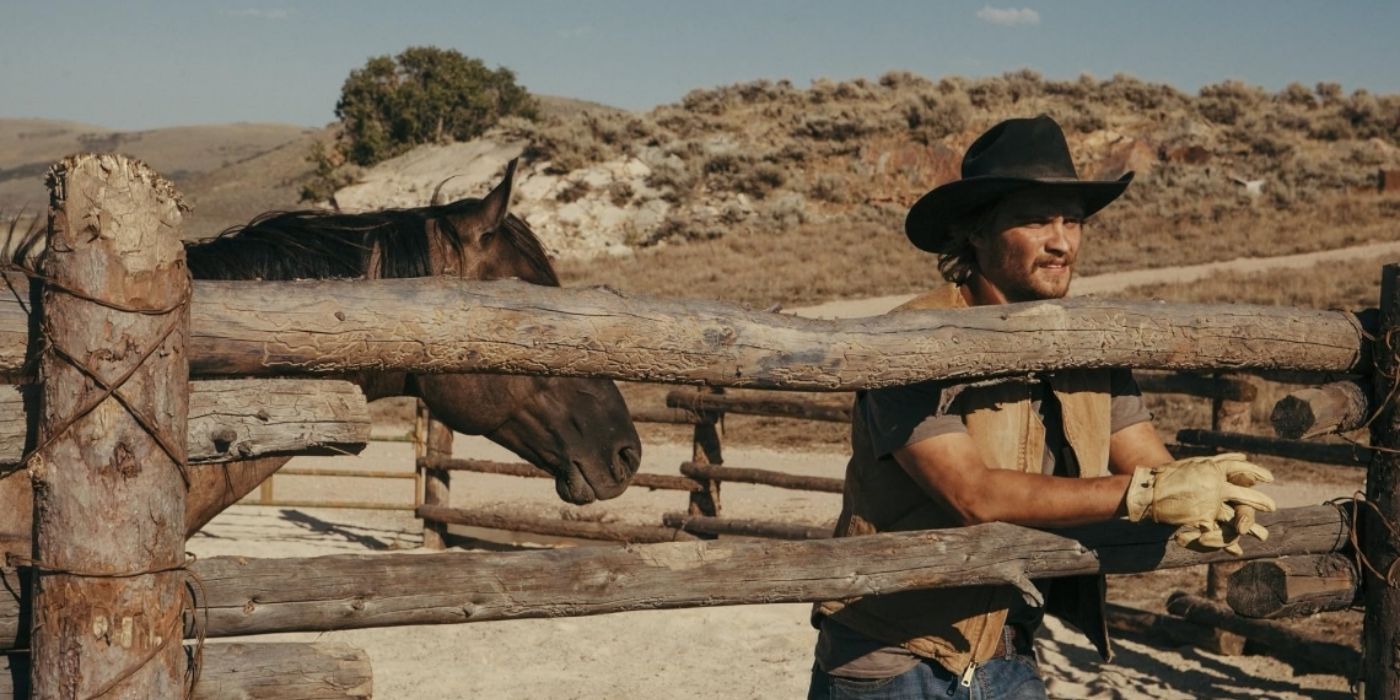 Kayce Dutton looking over a fence in Yellowstone