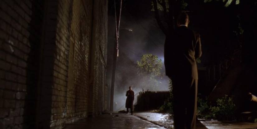 Michael Potts as Brother Mouzone and Michael K. Williams as Omar in the background in a scene from The Wire.
