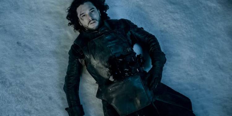 Jon Snow lying dead in the snow in Game of Thrones.