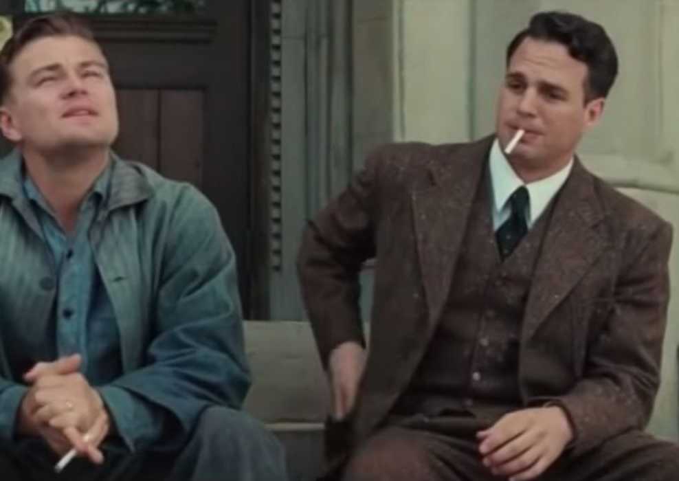 Mark Ruffalo sitting on steps with Leonardo DiCaprio in Shutter Island