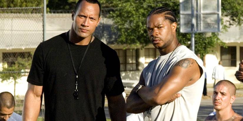 Sean (Dwayne Johnson) and Malcolm (Xzibit) coaching in Gridiron Gang