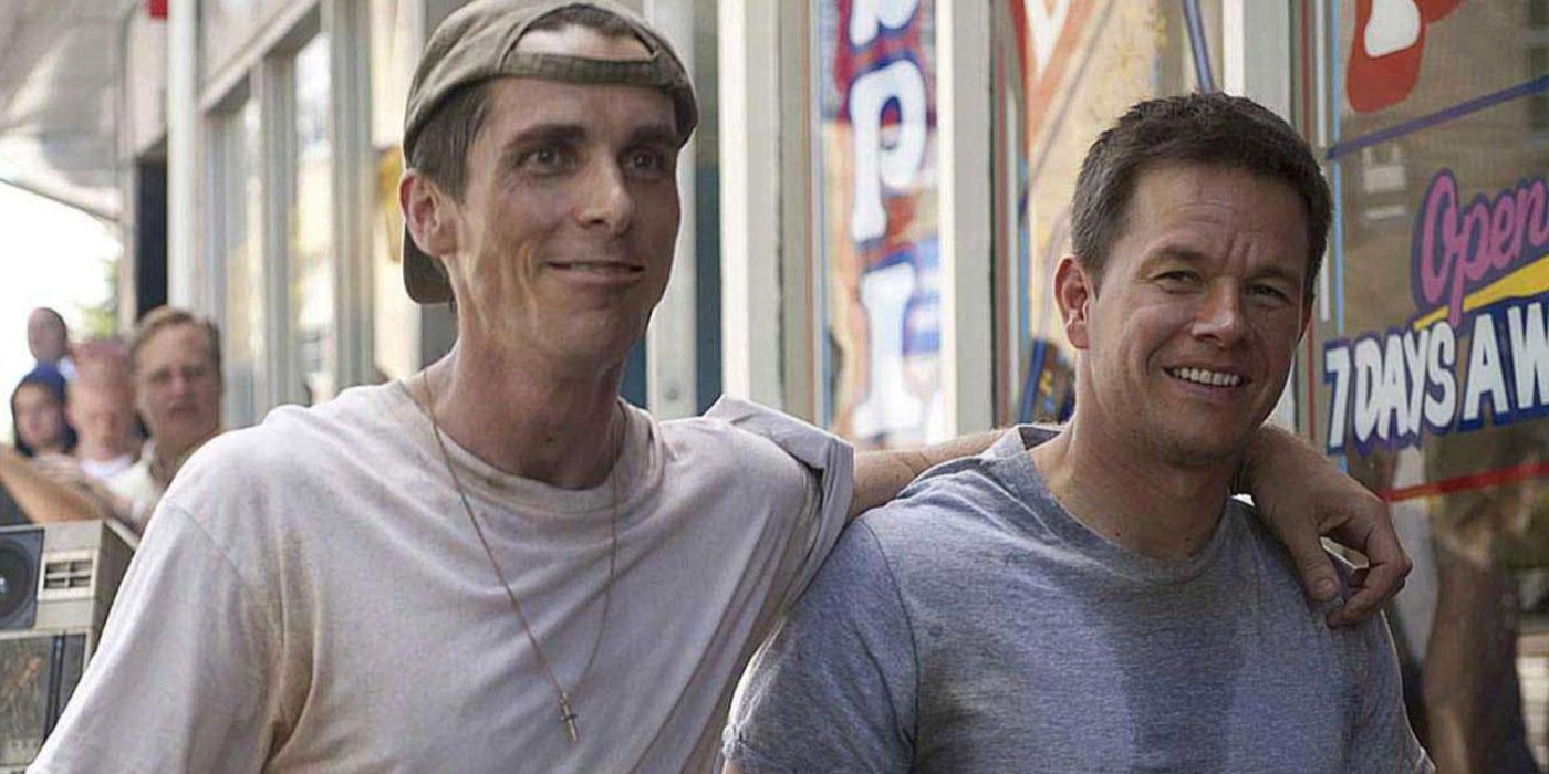 Dicky (Christian Bale) and Micky (Mark Wahlberg) walking through the street in The Fighter