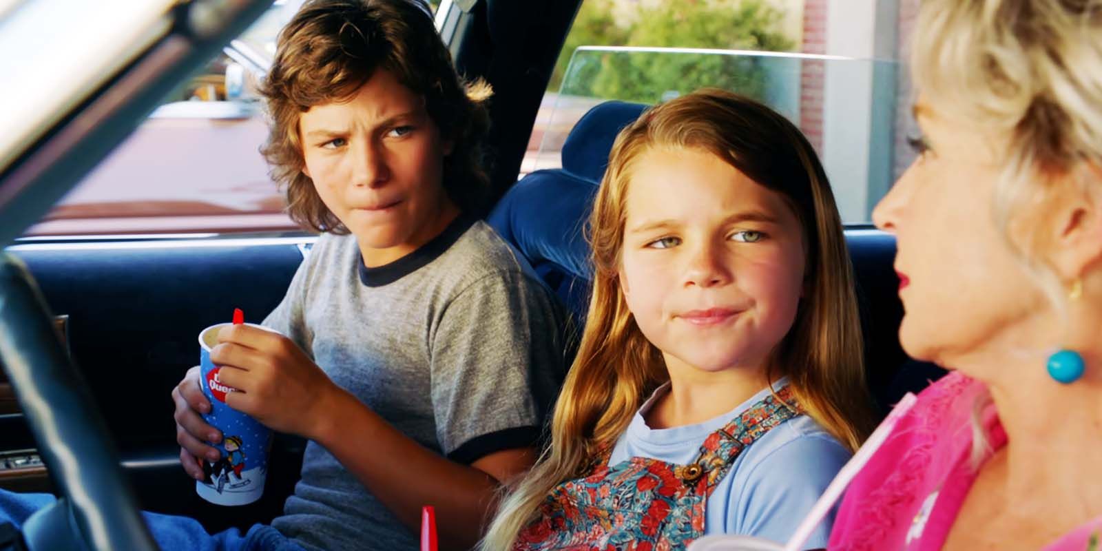 Georgie, Missy, and Connie sitting in the front seats of a car in Young Sheldon season 1 episode 4