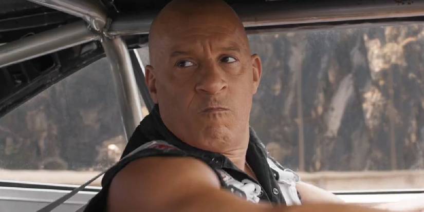 Vin Diesel as Dom looking determined inside his car in Fast X.