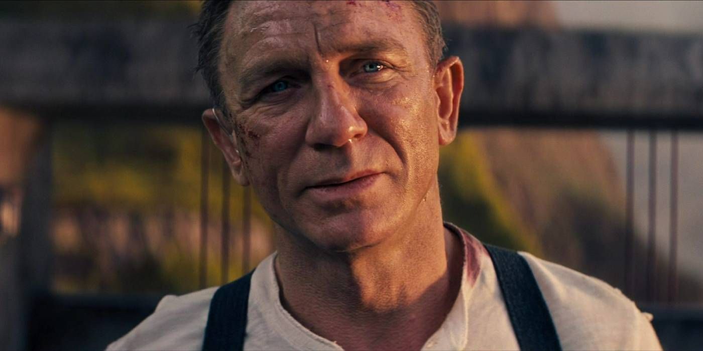 Daniel Craig smiles as James Bond in No Time To Die