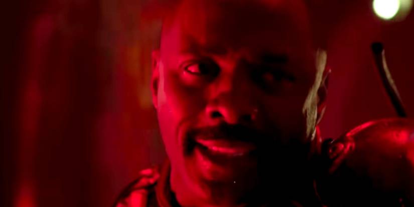 Idris Elba in close-up bathed in red light in Pacific Rim
