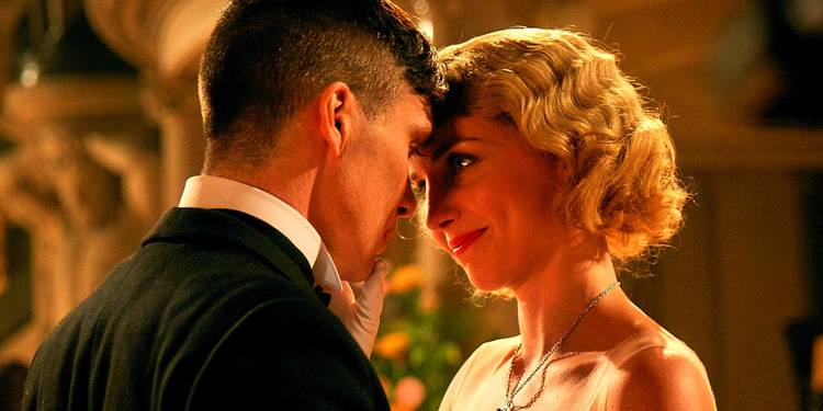 Annabelle Wallis as Grace and Cillian Murphy as Tommy Shelby dancing together in Peaky Blinders.