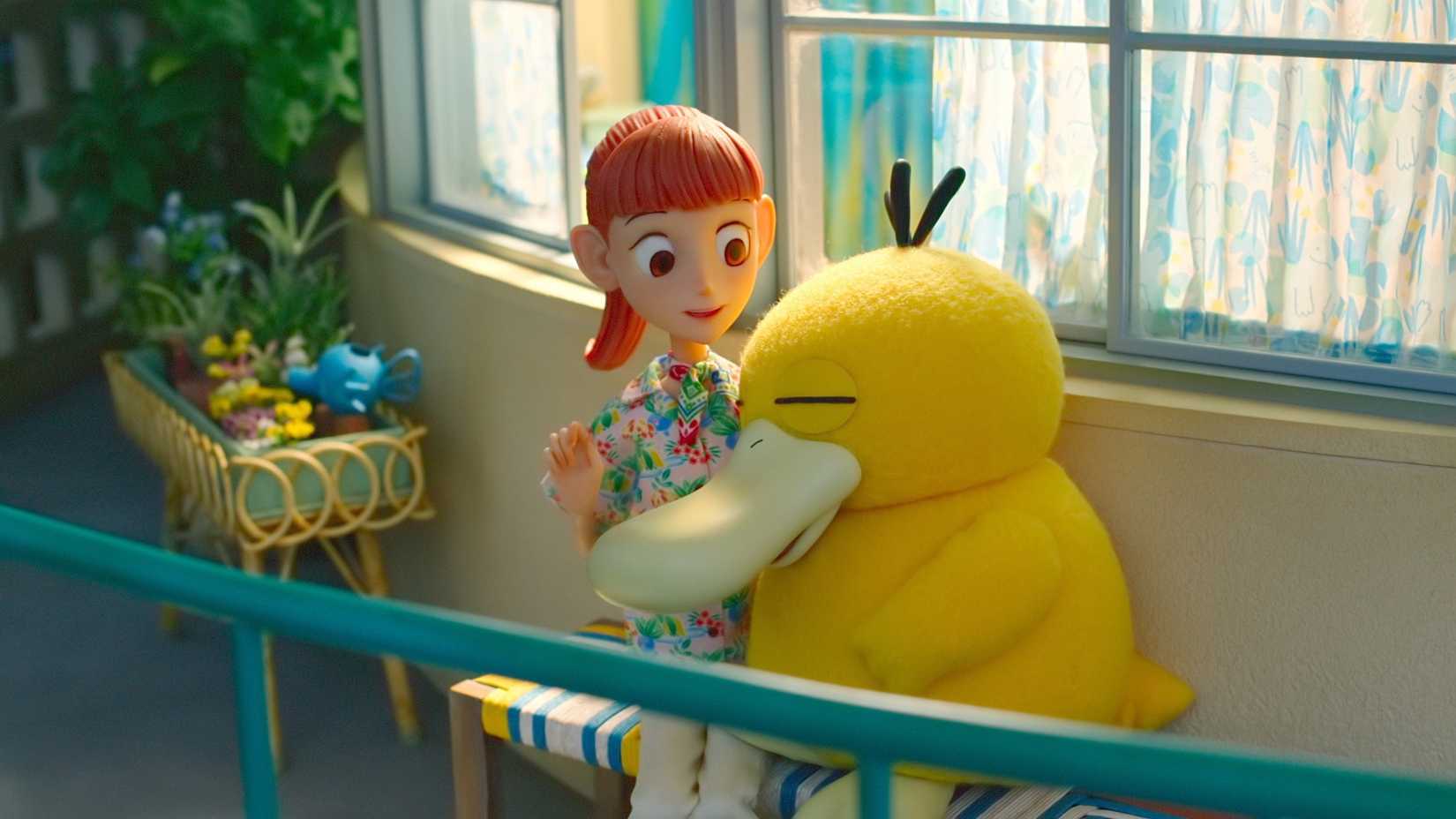 The protagonist of Pokemon Concierge with a Psyduck.