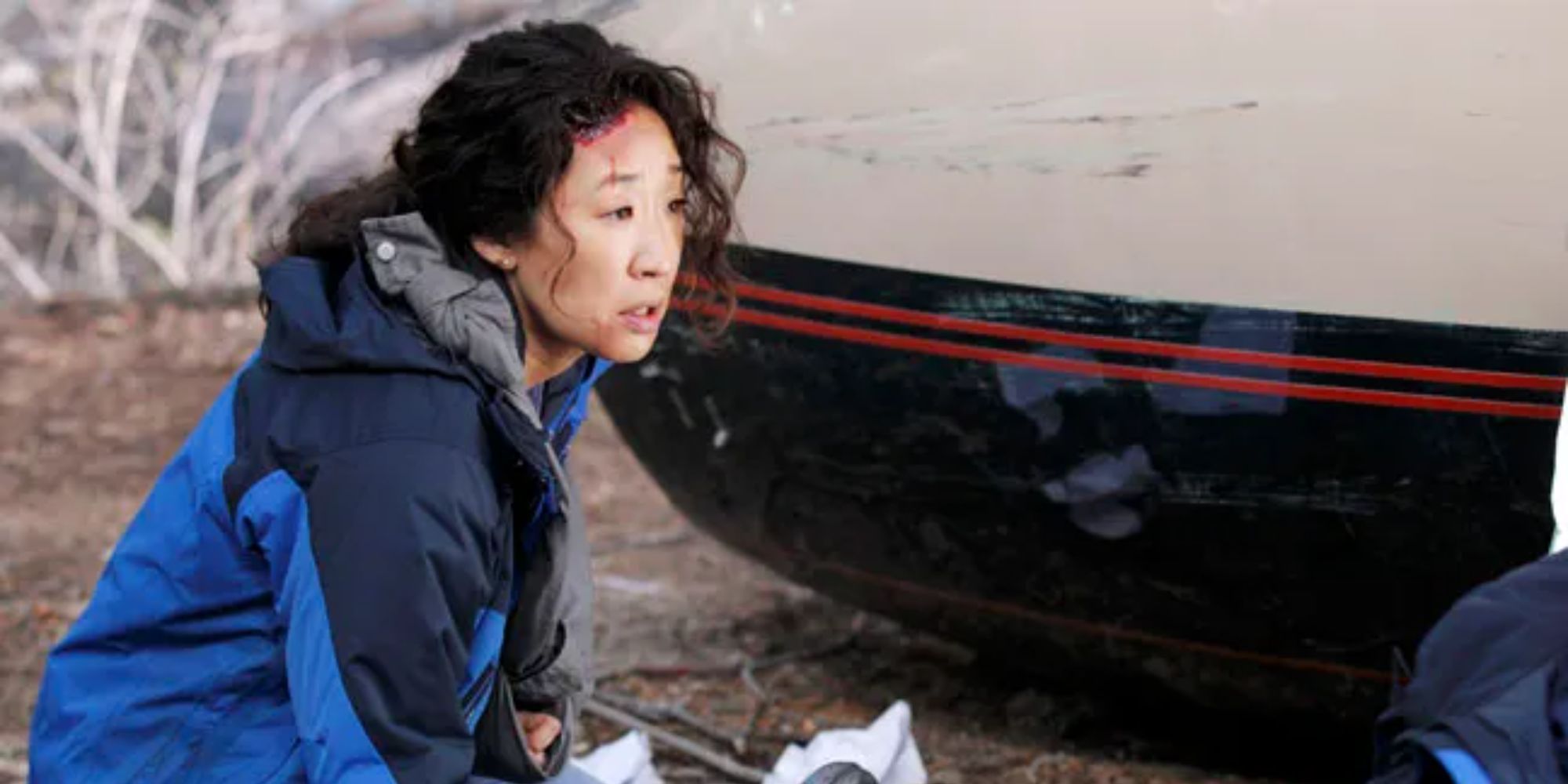 Cristina has blood on her forehead after the plane crash.