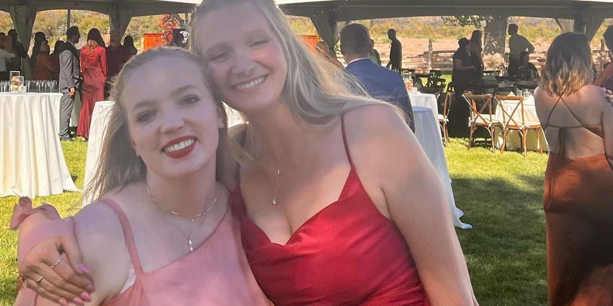 Savanah and Ysabel from Sister Wives in formal wear at wedding