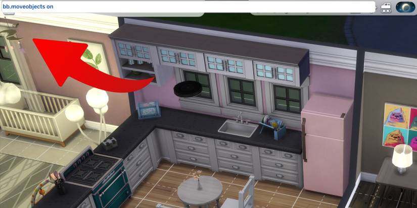 Sims 4: Cheat box with the move-objects cheat typed in.
