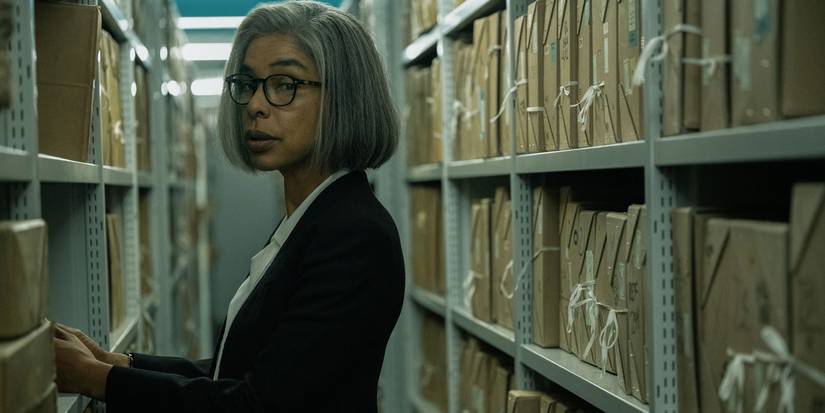 Sophie Okonedo looking over her shoulder in a library in Slow Horses